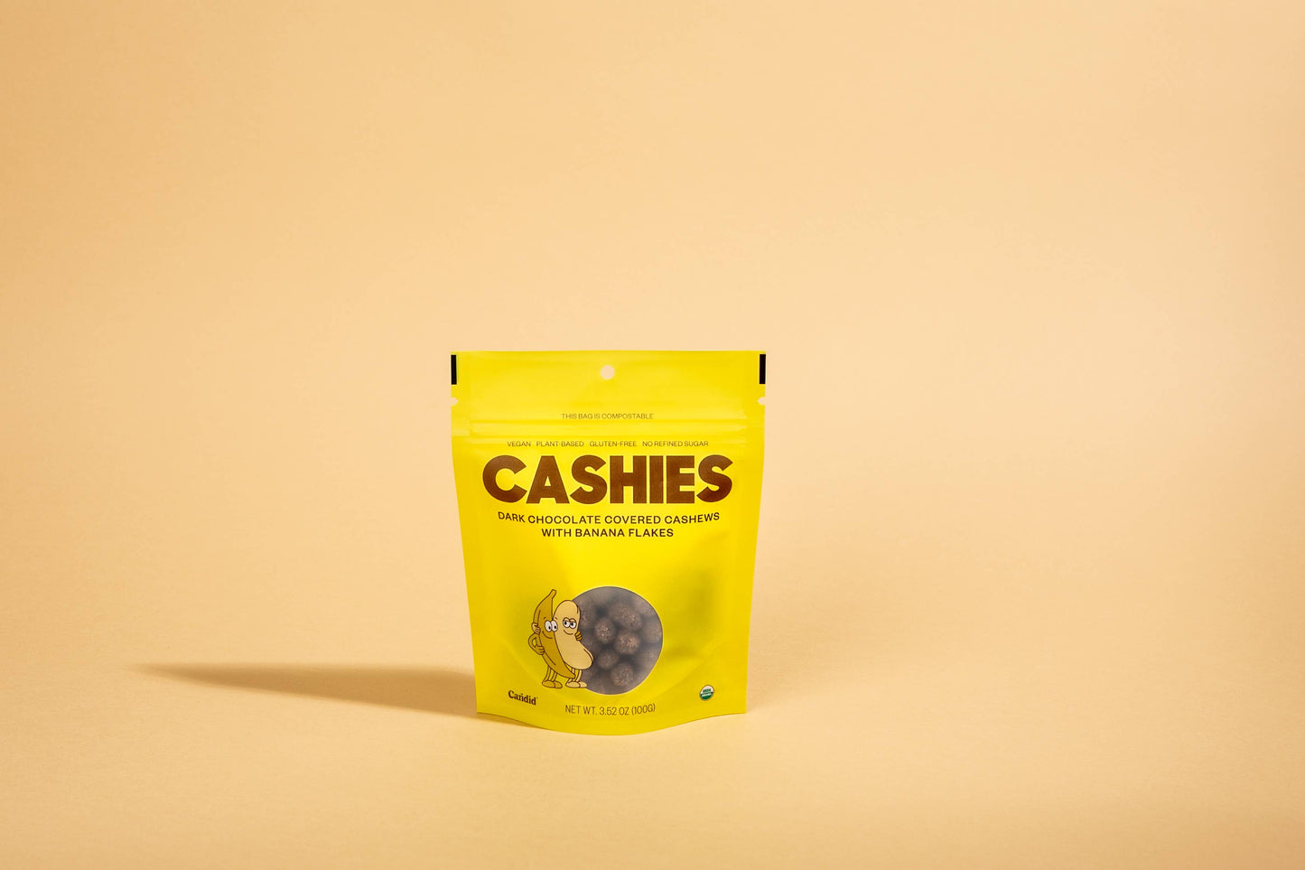 Candid | CASHIES — Chocolate covered cashews with banana flakes